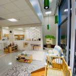 Photo of downtown classroom, play area, and windows
