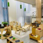 Photo of downtown preschool classroom, with preschool furniture and toys