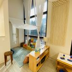 Photo of downtown preschool classroom, with preschool furniture and toys