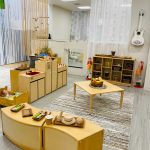 Photo of downtown preschool classroom, with preschool furniture and toys