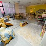 Photo of downtown preschool classroom, with preschool furniture and toys