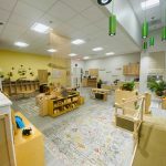 Photo of downtown preschool classroom, with preschool furniture and toys