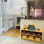 Photo of downtown preschool classroom, with preschool furniture and toys