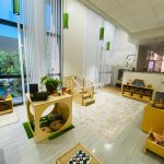 Photo of downtown preschool classroom, with preschool furniture and toys