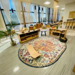 Photo of downtown preschool classroom, with preschool furniture and toys