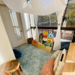 Photo of downtown preschool classroom, with preschool furniture and toys